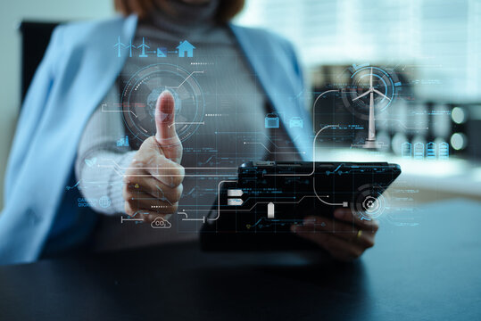 Woman using futuristic interface with smart tech and mobile to manage ESG, clean energy, and sustainability data. - Powered by Adobe