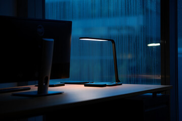 Computer network server room with desks and monitors in a modern office interior