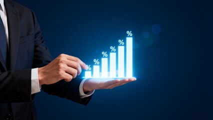 Businessman holding glowing growth chart