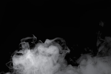 Wisps of white smoke isolated on a black background with space for text