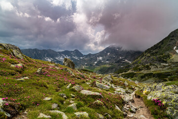 Summer scenery in the Transylvanian Alps with spectacular imagery and dramatic storm clouds, in July and August