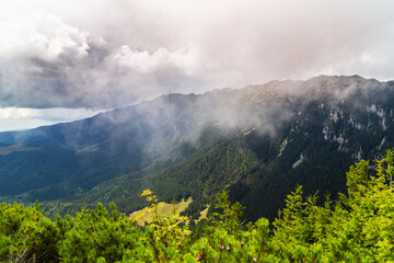 Summer scenery in the Transylvanian Alps with spectacular imagery and dramatic storm clouds, in July and August