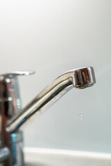 Leaking faucet with water dripping