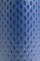 Blue textured rubber surface with raised diamond grip pattern