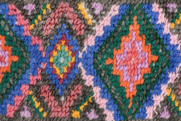 Traditional geometric cross-stitch embroidery pattern texture background