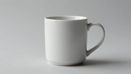 Fototapeta premium White ceramic mug on neutral background