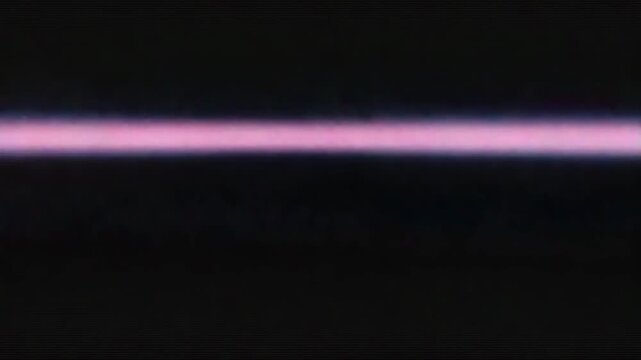 Flickering animation with a screen glitch effect pulsates with flashes of distorted pixels, moving in rhythmic waves of digital noise and color interference