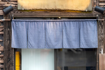 The curtain-like fabric that hangs in front of traditional Japanese restaurants and shops not only serves as a signboard, but holds a larger meaning,