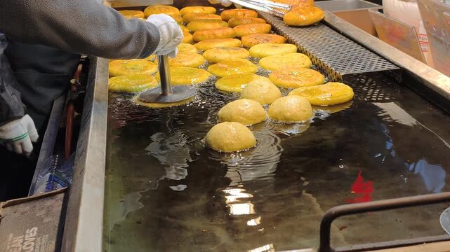 Vivid authentic Asian market scene. Vendor activity shows rapid cooking pace. Asian market scene buzz, energy attract customers. Authentic Asian market scene.