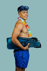 Tourist wearing diving mask and lei holding flippers getting ready for snorkeling © EDUARDOIVAN