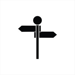A stark black silhouette of a crossroad signpost against a blank background