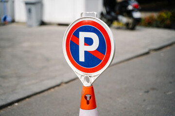 No Parking Road Sign on Orange Traffic Cone