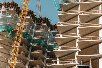 Construction of a building. Construction site with crane. Business, development, industry.