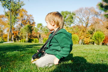  Child Learning Photography with Camera in Nature