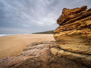 Praia do Norte beach rock formation and cloudy sky