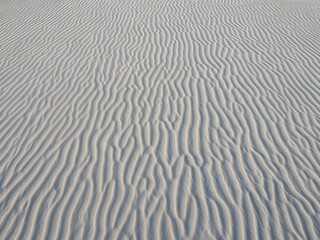 Clean Beach Sand Ripples from Above, Soft Natural Wave Pattern Texture Background
