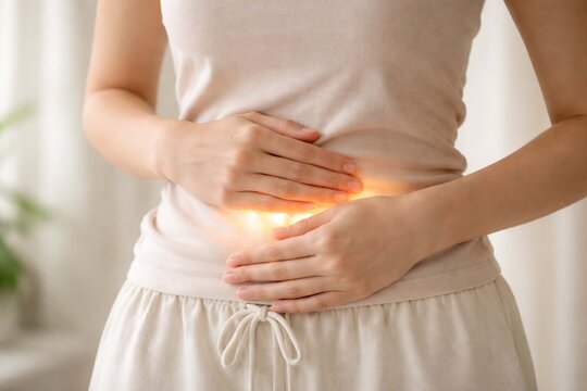 Conceptual image representing digestive health, gut wellness, and body care with warm glowing light on the abdomen.
