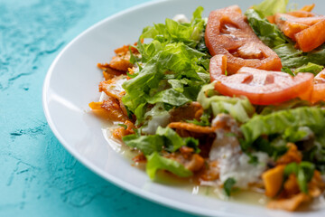 Close-Up of Chicken Kapsalon with Turkish Doner on White Plate