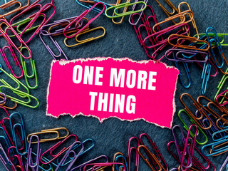One More Thing message written on ripped torn paper background. Conceptual One More Thing symbol. Copy space.