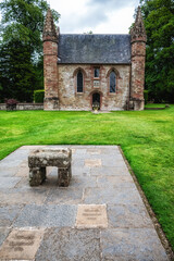 The chapel on Moot Hill with a replica of the stone of Scone in front, Scone Palace, Perth, Scotland