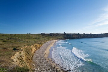 coastline with cliffs and blue sky