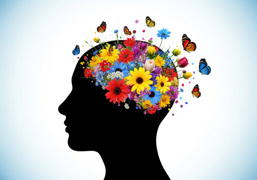 Human head silhouette with brain exploding into colorful flowers and butterflies.