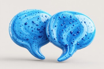 Two blue speech bubbles isolated on a white background designed to represent communication and conversation in a simple and clear manner for various uses