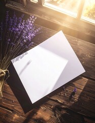 Blank White Card and Lavender Bunch on Wooden Table by Window.
