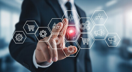 A businessman in a dark suit interacts with virtual hexagon icons on a transparent screen. High tech concepts such as e-commerce and digital marketing, set against a bright, blurred office backdrop.