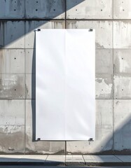 Blank White Poster Attached to a Textured Concrete Wall with Sunlight and Shadows.
