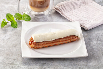 White vanilla eclair with icing