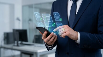 a businessman in a suit interacts with a digital interface projected from his smartphone illustrating modern technology and data management in an office