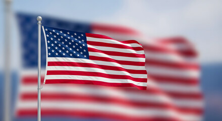 American flag waving in front of blurred background with another flag