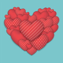 Many red heart shaped balloons in various designs combined to form large heart on light blue background