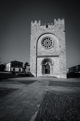 Traditional rural stone house with wooden gallery and slate roof
