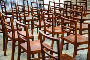 Wooden chairs in the empty meeting room