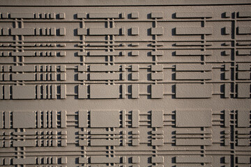 Mur avec motifs en reliefs g&eacute;om&eacute;triques peint en beige