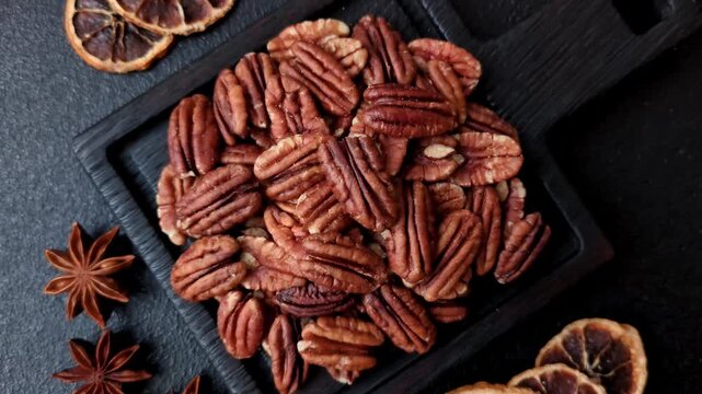 Peeled and roasted pecan nut as an ingredient for healthy foods and snacks. Pecan nut as a food background for your design.