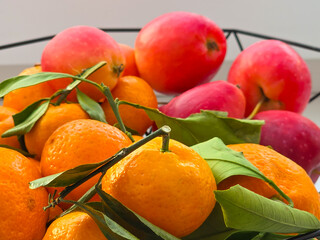 Tangerines with leaves and mini apples
