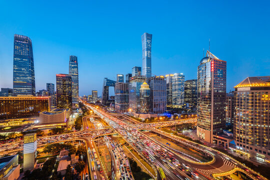 High angle night view of the bustling CBD and Guomao Overpass in Beijing, China
