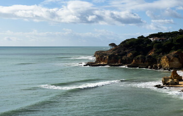 View of the sea and rocks of the beach of Olhos de Agua, Albufeira, Algarve, Portugal.
