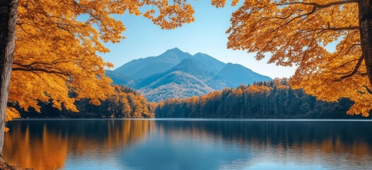 Autumnal lake scene framed by golden trees and mountains