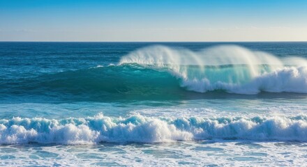 Fototapeta premium A crashing ocean wave, turquoise water, cresting and breaking, with sea foam and blue sky