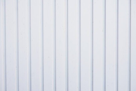 white garage door background with vertical siding panels