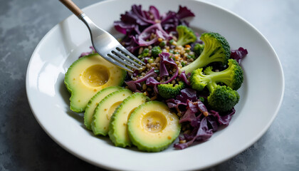 Freshly prepared salad featuring sliced avocado, vibrant purple cabbage, broccoli florets, and grains, beautifully arranged in a white bowl, showcasing healthy eating and nutrition