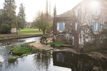 Buildings small vineyard on the Dronne River, Brantome, Brantome-en-Perigord, France