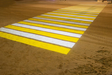 Light projection of a pedestrian crossing at night in the city during winter.