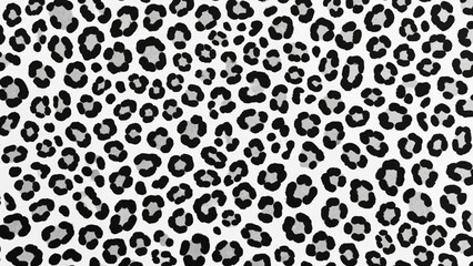 A close-up view of a black and white leopard print pattern on a fabric or textile
