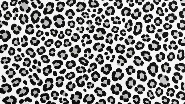 A close-up view of a black and white leopard print pattern on a fabric or textile