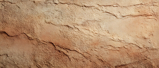 Fototapeta premium Earthy texture background panorama with rough cracked stone wall detail and warm natural color tone creating rustic aged surface design for banner or web header use